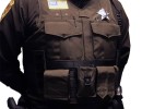 brown vest on officer